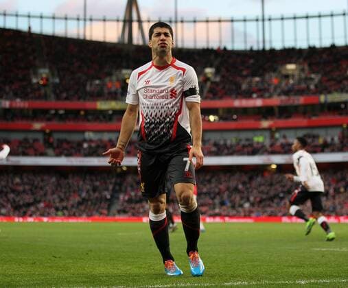 Liverpool s Luis Suarez looks on dejected Arsenal vs Liverpool - FA Cup Fifth Round - Emirates Stadium - London - England - 16 02 2014 - EDITORIAL USE ONLY. No use with unauthorised audio, video, data, fixture lists, club league logos or live services. Online in-match use limited to 120 images, no video emulation. No use in betting, games or single club league player publications.