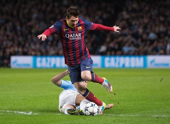 Martin Demichelis of Manchester City brings down Lionel Messi of Barcelona to earn a red card - UEFA Champions League First Knockout Round - Manchester City vs Barcelona - Etihad Stadium - Manchester - England - 18th February 2014 - Picture Phil Oldham Sportimage EDITORIAL USE ONLY. No use with unauthorised audio, video, data, fixture lists, club league logos or live services. Online in-match use limited to 120 images, no video emulation. No use in betting, games or single club league player publications.