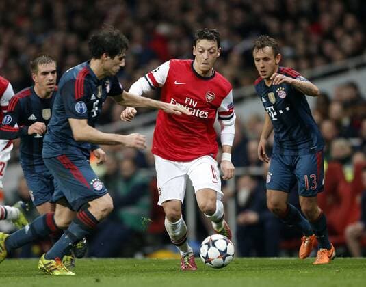 Arsenal s Mesut Ozil in action Arsenal vs FC Bayern Munich - UEFA Champions League - Emirates Stadium - London - England - 19 02 2014 - Pic David Klein Sportimage EDITORIAL USE ONLY. No use with unauthorised audio, video, data, fixture lists, club league logos or live services. Online in-match use limited to 120 images, no video emulation. No use in betting, games or single club league player publications.