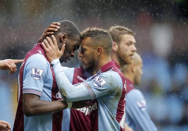 Christian Benteke of Aston Villa celebrates scoring the second goal of the game for his side with Ryan Bertrand (right) - Footballl - Barclays Premier League - Aston Villa vs Norwich City - Villa Park Birmingham - Season 2013 14 - 2nd March 2014 EDITORIAL USE ONLY. No use with unauthorised audio, video, data, fixture lists, club league logos or live services. Online in-match use limited to 120 images, no video emulation. No use in betting, games or single club league player publications.