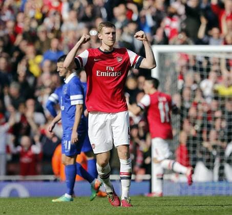 Arsenal s Per Mertesacker celebrates his sides fourth goal Arsenal v Everton - FA Cup Quarter Final - Emirates Stadium - London - England - 08 03 2014 - Pic David Klein Sportimage EDITORIAL USE ONLY. No use with unauthorised audio, video, data, fixture lists, club league logos or live services. Online in-match use limited to 120 images, no video emulation. No use in betting, games or single club league player publications.
