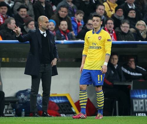 Arsenal s Mesut Özil looks on dejected Bayern Munich v Arsenal - Champions League last 16 - Allianz Arena - Munich - Germany - 11 03 2014 - Pic DavidKlein Sportimage EDITORIAL USE ONLY. No use with unauthorised audio, video, data, fixture lists, club league logos or live services. Online in-match use limited to 120 images, no video emulation. No use in betting, games or single club league player publications.