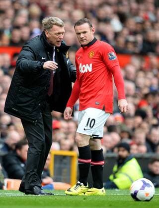 David Moyes manager of Manchester United talks to Wayne Rooney of Manchester United - Barclays Premier League - Manchester Utd vs Liverpool - Old Trafford Stadium - Manchester - England - 16th March 2014 - Pic Simon Bellis Sportimage EDITORIAL USE ONLY. No use with unauthorised audio, video, data, fixture lists, club league logos or live services. Online in-match use limited to 120 images, no video emulation. No use in betting, games or single club league player publications.