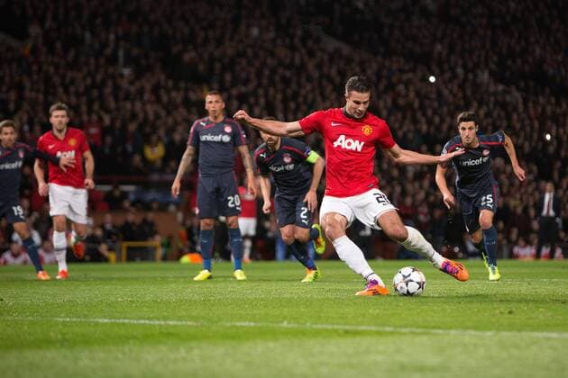 Robin van Persie of Manchester United scores the opening goal - UEFA Champions League Round of 16 - Manchester United vs. Olympiacos - Old Trafford - Manchester - England - 19th March 2014 - Picture Philip Oldham Sportimage EDITORIAL USE ONLY. No use with unauthorised audio, video, data, fixture lists, club league logos or live services. Online in-match use limited to 120 images, no video emulation. No use in betting, games or single club league player publications.