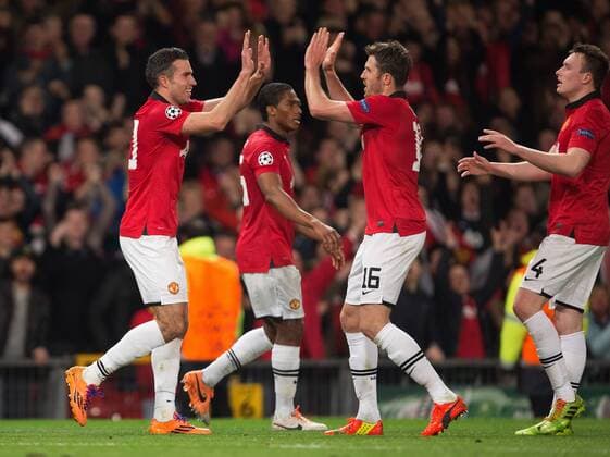 Robin van Persie of Manchester United celebrates his second goal - UEFA Champions League Round of 16 - Manchester United vs. Olympiacos - Old Trafford - Manchester - England - 19th March 2014 - Picture Philip Oldham Sportimage EDITORIAL USE ONLY. No use with unauthorised audio, video, data, fixture lists, club league logos or live services. Online in-match use limited to 120 images, no video emulation. No use in betting, games or single club league player publications.