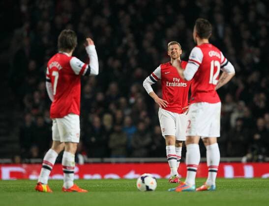 Arsenal s Per Mertesacker looks on dejected after going 1-0 down Arsenal vs Swansea City - Premier League - Emirates Stadium- London - England - 25 03 2014 - Pic David Klein Sportimage EDITORIAL USE ONLY. No use with unauthorised audio, video, data, fixture lists, club league logos or live services. Online in-match use limited to 120 images, no video emulation. No use in betting, games or single club league player publications.
