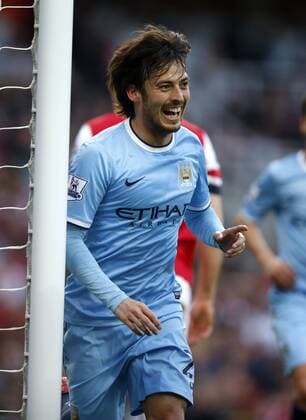 David Silva of Manchester City celebrates scoring during the Barclays Premier League match between Arsenal and Manchester City at Emirates Stadium in London, Britain on March 29, 2014. The match ended with a 1-1 draw. (Xinhua Wang Lili) (SP) LONDON-SOCCER-PREMIER LEAGUE-- ARSENAL FC London VS MANCHESTER CITY