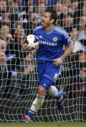 Frank Lampard of Chelsea celebrates scoring during the Barclays Premier League match between Chelsea and Stoke City at Emirates Stadium in London, Britain on April 5, 2014. Chelsea won 3-0. (Xinhua Wang Lili) FOR EDITORIAL USE ONLY. NOT FOR SALE FOR MARKETING OR ADVERTISING CAMPAIGNS. NO USE WITH UNAUTHORIZED AUDIO, VIDEO, DATA, FIXTURE LISTS, CLUB LEAGUE LOGOS OR LIVE SERVICES. ONLINE IN-MATCH USE LIMITED TO 45 IMAGES, NO VIDEO EMULATION. NO USE IN BETTING, GAMES OR SINGLE CLUB LEAGUE PLAYER PUBLICATIONS. (SP)BRITAIN-LONDON-SOCCER-PREMIER LEAGUE-CHELSEA VS STOKE CITY