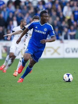 Football - 2013 2014 Premier League - Swansea City vs. Chelsea John Mikel of Chelsea attacks at the the Liberty Stadium. COLORSPORT WINSTON BYNORTH