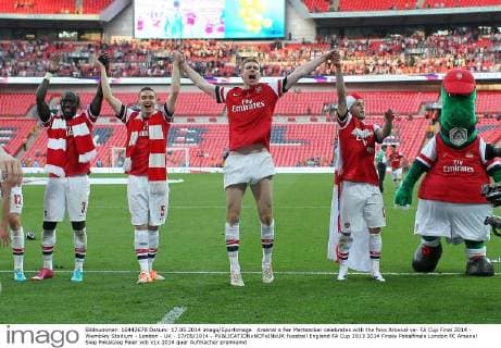 Arsenal s Per Mertsacker celebrates with the fans Arsenal vs- FA Cup Final 2014 - Wembley Stadium - London - UK - 17 05 2014 - EDITORIAL USE ONLY. No use with unauthorised audio, video, data, fixture lists, club league logos or live services. Online in-match use limited to 120 images, no video emulation. No use in betting, games or single club league player publications.