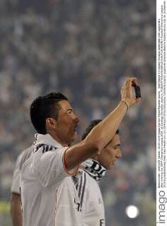 Real Madrid s Cristiano Ronaldo celebrates with supporters after winning the UEFA Champions League 2014, at Santiago Bernabeu stadium.