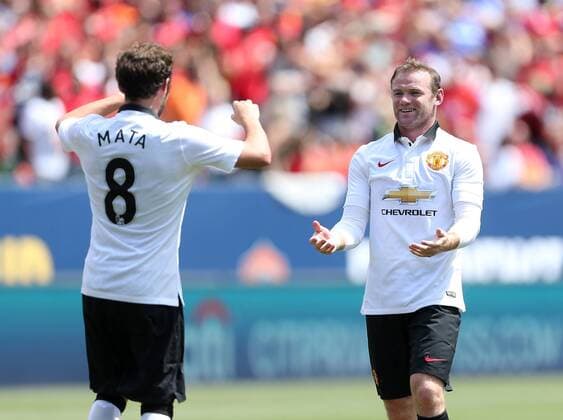 Manchester United s Wayne Rooney celebrates scoring his sides opening goal with Juan Mata - International Champions Cup 2014 - AS Roma v Manchester United - Sports Authority Field - Denver - USA - 26th July 2014 - Picture David Klein Sportimage EDITORIAL USE ONLY. No use with unauthorised audio, video, data, fixture lists, club league logos or live services. Online in-match use limited to 120 images, no video emulation. No use in betting, games or single club league player publications.