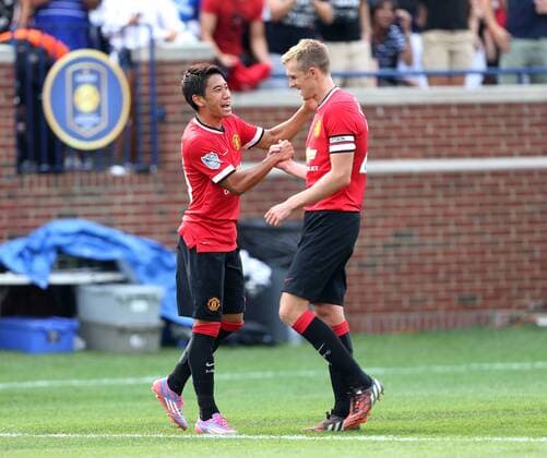 Manchester United s Shinji Kagawa celebrates setting up his sides third goal with Darren Fletcher - International Champions Cup 2014 - Manchester United vs Real Madrid - Michigan Stadium - Ann Arbor - USA - 2nd August 2014 - Picture David Klein Sportimage EDITORIAL USE ONLY. No use with unauthorised audio, video, data, fixture lists, club league logos or live services. Online in-match use limited to 120 images, no video emulation. No use in betting, games or single club league player publications.