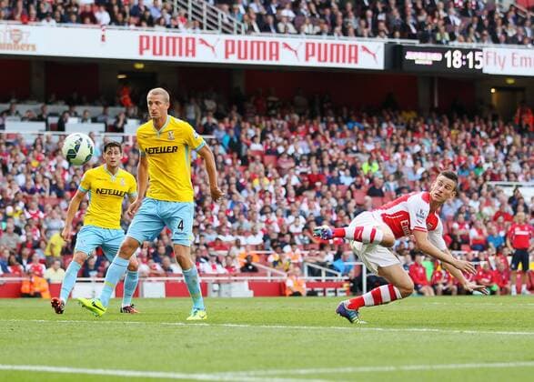 Arsenal s Laurent Koscielny scoring his sides opening goal - Barclays Premier League - Arsenal vs Crystal Palace - Emirates Stadium - London - England - 16th August 2014 - Picture David Klein Sportimage EDITORIAL USE ONLY. No use with unauthorised audio, video, data, fixture lists, club league logos or live services. Online in-match use limited to 120 images, no video emulation. No use in betting, games or single club league player publications.