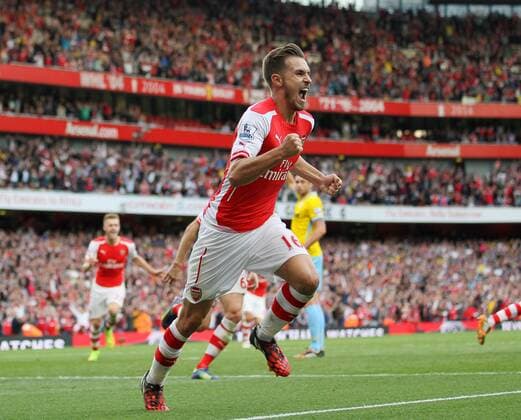 Arsenal s Aaron Ramsey celebrates scoring his sides second goal - Barclays Premier League - Arsenal vs Crystal Palace - Emirates Stadium - London - England - 16th August 2014 - Picture David Klein Sportimage EDITORIAL USE ONLY. No use with unauthorised audio, video, data, fixture lists, club league logos or live services. Online in-match use limited to 120 images, no video emulation. No use in betting, games or single club league player publications.