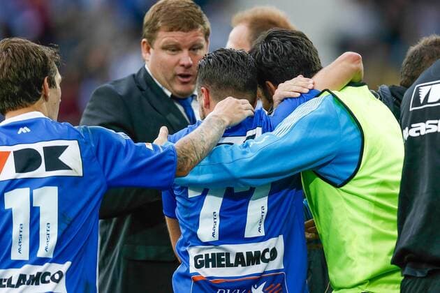 20140817 - GENT, BELGIUM: Gent s Danijel Milicevic (C) celebrates with his teammates and coach Hein Vanhaezebrouck (CL rear) after scoring during the Jupiler Pro League match between KAA Gent and Zulte Waregem, in Gent, Sunday 17 August 2014, on day 4 of the Belgian soccer championship. BRUNOxFAHY 04280147