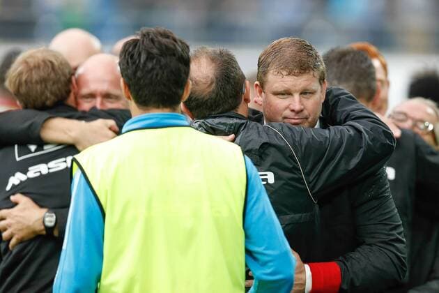 20140817 - GENT, BELGIUM: Gent s head coach Hein Vanhaezebrouck (R) celebrates with his staff after winning the Jupiler Pro League match between KAA Gent and Zulte Waregem, in Gent, Sunday 17 August 2014, on day 4 of the Belgian soccer championship. BRUNOxFAHY 04280335
