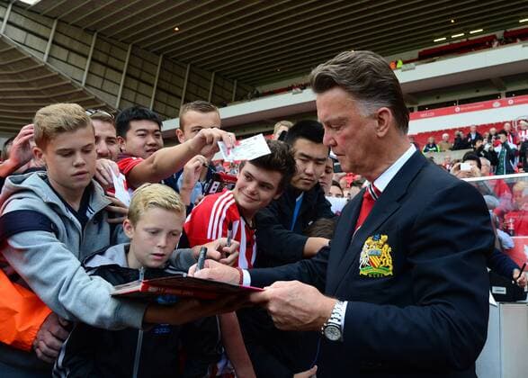 Louis van Gaal manager of Manchester United signs autographs for Sunderland fans - Barclays Premier League - Sunderland vs Manchester Utd - Stadium of Light - Sunderland - England - 24th August 2014 - EDITORIAL USE ONLY. No use with unauthorised audio, video, data, fixture lists, club league logos or live services. Online in-match use limited to 120 images, no video emulation. No use in betting, games or single club league player publications.