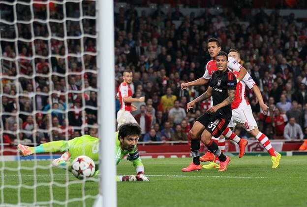 Arsenal s Alexis Sanchez scoring his sides opening goal - UEFA Champions League, Play-off Second Leg - Emirates Stadium - England - 27th August 2014 - Picture David Klein Sportimage EDITORIAL USE ONLY. No use with unauthorised audio, video, data, fixture lists, club league logos or live services. Online in-match use limited to 120 images, no video emulation. No use in betting, games or single club league player publications.