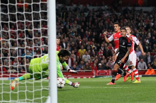 Arsenal s Alexis Sanchez scoring his sides opening goal - UEFA Champions League, Play-off Second Leg - Emirates Stadium - England - 27th August 2014 - Picture David Klein Sportimage EDITORIAL USE ONLY. No use with unauthorised audio, video, data, fixture lists, club league logos or live services. Online in-match use limited to 120 images, no video emulation. No use in betting, games or single club league player publications.
