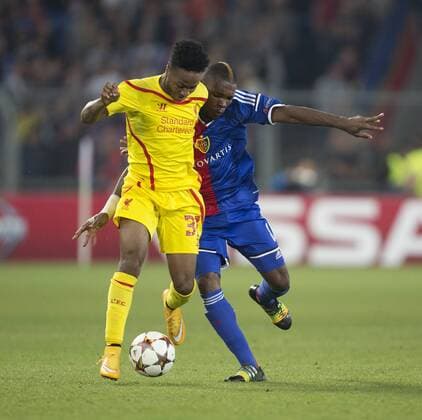 Raheem Sterling of Liverpool battles Serey Die of Basel - FC Basel vs. Liverpool - UEFA Champions League - St Jakobs Park - Basel - 01 10 2014 Pic Philip Oldham Sportimage EDITORIAL USE ONLY. No use with unauthorised audio, video, data, fixture lists, club league logos or live services. Online in-match use limited to 120 images, no video emulation. No use in betting, games or single club league player publications.