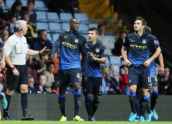 Yaya Toure of Manchester City (l) celebrates scoring the first goal - Barclays Premier League - Aston Villa vs Manchester City - - England - 4th October 2014 - Picture SimonxBellis Sportimage EDITORIAL USE ONLY. No use with unauthorised audio, video, data, fixture lists, club league logos or live services. Online in-match use limited to 120 images, no video emulation. No use in betting, games or single club league player publications.