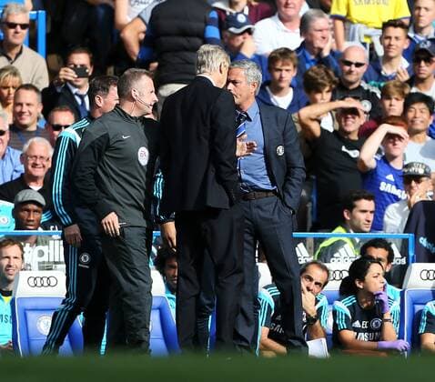 Chelsea s Jose Mourinho and Arsenal s Arsene Wenger square up to each other - Barclays Premier League - Chelsea Vs Arsenal - Stamford Bridge - England - 5th October 2014 - Picture David Klein Sportimage EDITORIAL USE ONLY. No use with unauthorised audio, video, data, fixture lists, club league logos or live services. Online in-match use limited to 120 images, no video emulation. No use in betting, games or single club league player publications.