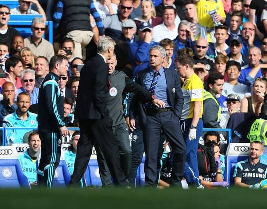 Chelsea s Jose Mourinho and Arsenal s Arsene Wenger square up to each other - Barclays Premier League - Chelsea Vs Arsenal - Stamford Bridge - England - 5th October 2014 - Picture David Klein Sportimage EDITORIAL USE ONLY. No use with unauthorised audio, video, data, fixture lists, club league logos or live services. Online in-match use limited to 120 images, no video emulation. No use in betting, games or single club league player publications.