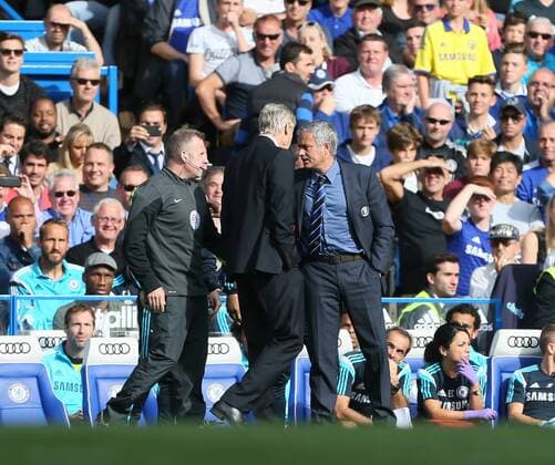 Chelsea s Jose Mourinho and Arsenal s Arsene Wenger square up to each other - Barclays Premier League - Chelsea Fc vs FC Arsenal - Stamford Bridge - England - 5th October 2014 - EDITORIAL USE ONLY. No use with unauthorised audio, video, data, fixture lists, club league logos or live services. Online in-match use limited to 120 images, no video emulation. No use in betting, games or single club league player publications.