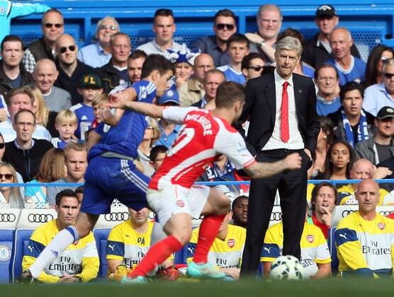 Arsenal s Arsene Wenger looks on - Barclays Premier League - Chelsea Vs Arsenal - Stamford Bridge - England - 5th October 2014 - EDITORIAL USE ONLY. No use with unauthorised audio, video, data, fixture lists, club league logos or live services. Online in-match use limited to 120 images, no video emulation. No use in betting, games or single club league player publications.