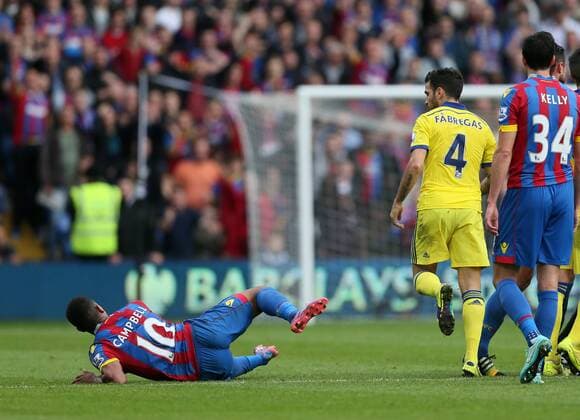 Chelsea s Cesc Fabregas throws Crystal Palace s Frazier Campbell to the ground - Barclays Premier League - Crystal Palace vs Chelsea - Selhurst Park - England - 18th October 2014 - Picture David Klein Sportimage EDITORIAL USE ONLY. No use with unauthorised audio, video, data, fixture lists, club league logos or live services. Online in-match use limited to 120 images, no video emulation. No use in betting, games or single club league player publications.