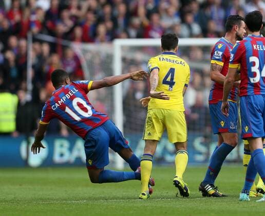 Chelsea s Cesc Fabregas throws Crystal Palace s Frazier Campbell to the ground - Barclays Premier League - Crystal Palace vs FC Chelsea London - Selhurst Park - England - 18th October 2014 - EDITORIAL USE ONLY. No use with unauthorised audio, video, data, fixture lists, club league logos or live services. Online in-match use limited to 120 images, no video emulation. No use in betting, games or single club league player publications.