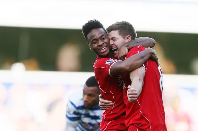 Liverpool s Raheem Sterling celebrates his sides winning goal with Steven Gerrard - Barclays Premier League - QPR vs Liverpool - Loftus Road - England - 19th October 2014 - Picture David Klein Sportimage EDITORIAL USE ONLY. No use with unauthorised audio, video, data, fixture lists, club league logos or live services. Online in-match use limited to 120 images, no video emulation. No use in betting, games or single club league player publications.