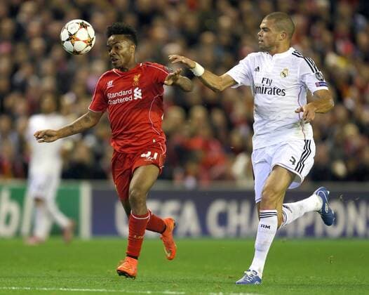 Raheem Sterling of Liverpool tussles with Pepe of Real Madrid - UEFA Champions League Group B - Liverpool vs Real Madrid - Anfield Stadium - Liverpool- England - 22nd October 2014 - Picture Simon Bellis Sportimage EDITORIAL USE ONLY. No use with unauthorised audio, video, data, fixture lists, club league logos or live services. Online in-match use limited to 120 images, no video emulation. No use in betting, games or single club league player publications.