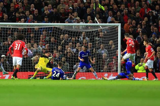 Robin van Persie of Manchester United scores in injury time to level it at 1-1 - Manchester United vs. Chelsea - Barclay s Premier League - Old Trafford - Manchester - 26 10 2014 Pic Philip Oldham Sportimage EDITORIAL USE ONLY. No use with unauthorised audio, video, data, fixture lists, club league logos or live services. Online in-match use limited to 120 images, no video emulation. No use in betting, games or single club league player publications.