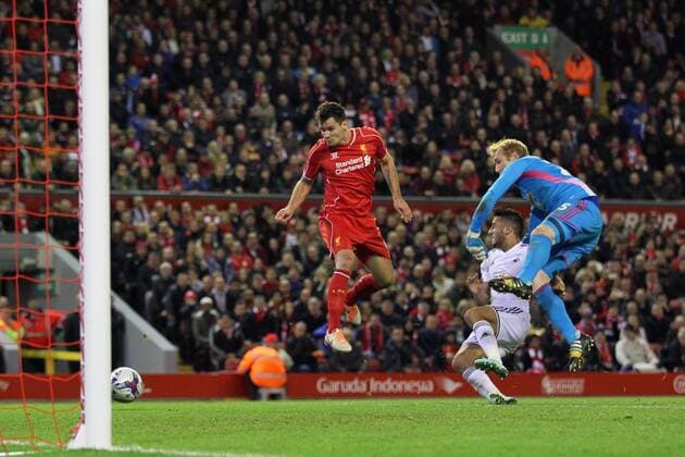 Liverpool s Dejan Lovren scoring his sides second goal League Cup Fourth Round- Liverpool vs Swansea City - Anfield - England - 28th October 2014 - Picture David Klein Sportimage EDITORIAL USE ONLY. No use with unauthorised audio, video, data, fixture lists, club league logos or live services. Online in-match use limited to 120 images, no video emulation. No use in betting, games or single club league player publications.