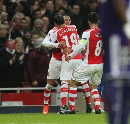 Arsenal s Alexis Sanchez celebrates scoring his sides second goal - Champions League Group D - Arsenal vs Anderlecht- Emirates Stadium - London - England - 4th November 2014 - Picture David Klein Sportimage EDITORIAL USE ONLY. No use with unauthorised audio, video, data, fixture lists, club league logos or live services. Online in-match use limited to 120 images, no video emulation. No use in betting, games or single club league player publications.