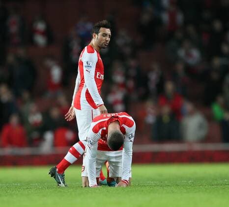Arsenal s Kieran Gibbs looks on dejected at the final whistle as Santi Cazorla walks past Barclays Premier League- Arsenal vs Manchester United - Emirates Stadium - England - 22nd November 2014 - Picture David Klein Sportimage EDITORIAL USE ONLY. No use with unauthorised audio, video, data, fixture lists, club league logos or live services. Online in-match use limited to 120 images, no video emulation. No use in betting, games or single club league player publications.