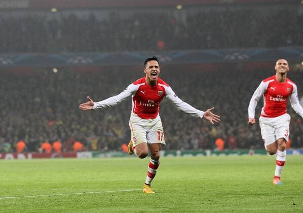 Arsenal s Alexis Sanchez celebrates scoring his sides second goal UEFA Champions League- Arsenal vs Borussia Dortmund- Emirates Stadium - England - 26th November 2014 - EDITORIAL USE ONLY. No use with unauthorised audio, video, data, fixture lists, club league logos or live services. Online in-match use limited to 120 images, no video emulation. No use in betting, games or single club league player publications.