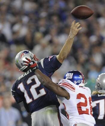 Feb. 3, 2008 - New England Patriots quarterback Tom Brady gets off a pass under pressure from New York Giants Gibril Wilson during Super Bowl XLII at University of Phoenix Stadium in Glendale, Arizona, on Sunday, February 3, 2008. (David Pokress Newsday MCT) News Archive - Feb. 3, 2008 - ZUMAm67_
