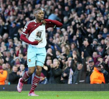 West Ham s Diafra Sakho celebreates scoring his sides third goal by showing his t-shirt Barclays Premier League- West Ham United vs Swansea City - Upton Park - England - 7th December 2014 - Picture David Klein Sportimage EDITORIAL USE ONLY. No use with unauthorised audio, video, data, fixture lists, club league logos or live services. Online in-match use limited to 120 images, no video emulation. No use in betting, games or single club league player publications.