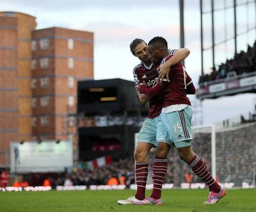 West Ham s Diafra Sakho celebreates scoring his sides third goal with Andy Carroll Barclays Premier League- West Ham United vs Swansea City - Upton Park - England - 7th December 2014 - Picture David Klein Sportimage EDITORIAL USE ONLY. No use with unauthorised audio, video, data, fixture lists, club league logos or live services. Online in-match use limited to 120 images, no video emulation. No use in betting, games or single club league player publications.
