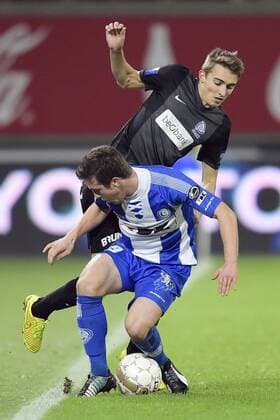 - GENT, BELGIUM: Gent s Brecht Dejaegere and Genk s Timothy Castagne fight for the ball during the Jupiler Pro League match between KAA Gent and KRC Genk, in Gent, Sunday 07 December 2014, on day 18 of the Belgian soccer championship. YORICKxJANSENS x04516835x