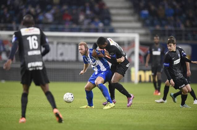 - GENT, BELGIUM: Gent s Laurent Depoitre and Genk s Christian Kabasele fight for the ball during the Jupiler Pro League match between KAA Gent and KRC Genk, in Gent, Sunday 07 December 2014, on day 18 of the Belgian soccer championship. JOHNxTHYS x04516907x