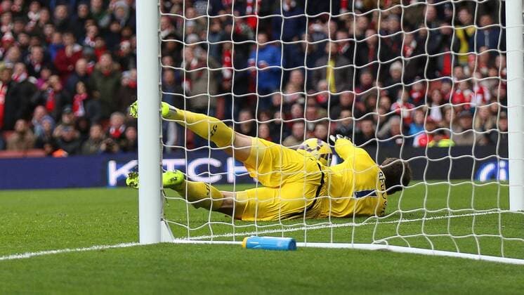 Football - 2014 2015 - Barclays Premier League, - Arsenal Vs Stoke City, Stoke City s Asmir Begovic dives to his right to stop Arsenal s AlexisSanchez shot at The Emirates Stadium ARS_STO
