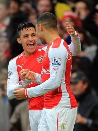 Arsenal s Alexis Sanchez celebrates scoring his sides third goal Premier League - Arsenal vs Stoke City - Emirates Stadium - England - 11th January 2015 - Picture David Klein Sportimage EDITORIAL USE ONLY. No use with unauthorised audio, video, data, fixture lists, club league logos or live services. Online in-match use limited to 120 images, no video emulation. No use in betting, games or single club league player publications.