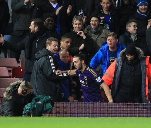 West Ham s Andy Carroll ends up in with Everton s fans FA Cup 3rd Round Replay - West Ham United - FC Everton - Upton Park - England - 13th January 2015 - EDITORIAL USE ONLY. No use with unauthorised audio, video, data, fixture lists, club league logos or live services. Online in-match use limited to 120 images, no video emulation. No use in betting, games or single club league player publications.