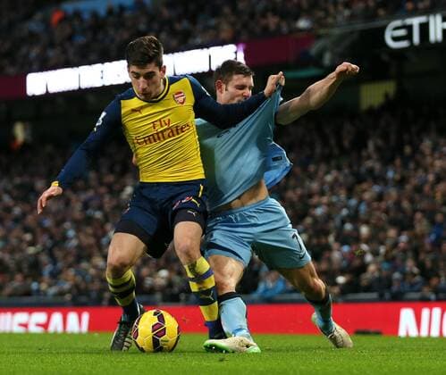 James Milner of Manchester City tussles with Hector Bellerin of Arsenal - Barclays Premier League - Manchester City vs Arsenal - Etihad Stadium - Manchester - England - 18th January 2015 - Picture Simon Bellis Sportimage EDITORIAL USE ONLY. No use with unauthorised audio, video, data, fixture lists, club league logos or live services. Online in-match use limited to 120 images, no video emulation. No use in betting, games or single club league player publications.