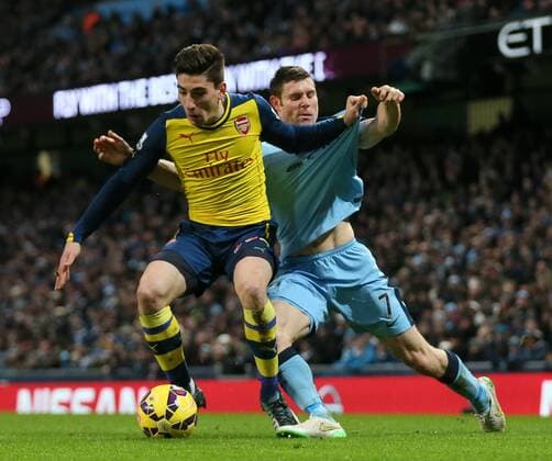 James Milner of Manchester City tussles with Hector Bellerin of Arsenal - Barclays Premier League - Manchester City vs Arsenal - Etihad Stadium - Manchester - England - 18th January 2015 - Picture Simon Bellis Sportimage EDITORIAL USE ONLY. No use with unauthorised audio, video, data, fixture lists, club league logos or live services. Online in-match use limited to 120 images, no video emulation. No use in betting, games or single club league player publications.