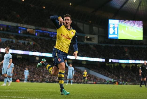 Olivier Giroud of Arsenal celebrates scoring his goal to make the score 0-2 - Barclays Premier League - Manchester City vs Arsenal - Etihad Stadium - Manchester - England - 18th January 2015 - Picture Simon Bellis Sportimage EDITORIAL USE ONLY. No use with unauthorised audio, video, data, fixture lists, club league logos or live services. Online in-match use limited to 120 images, no video emulation. No use in betting, games or single club league player publications.